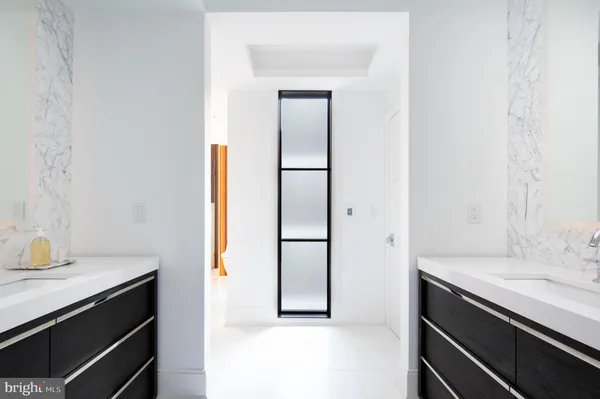 a living room with furniture and white walls