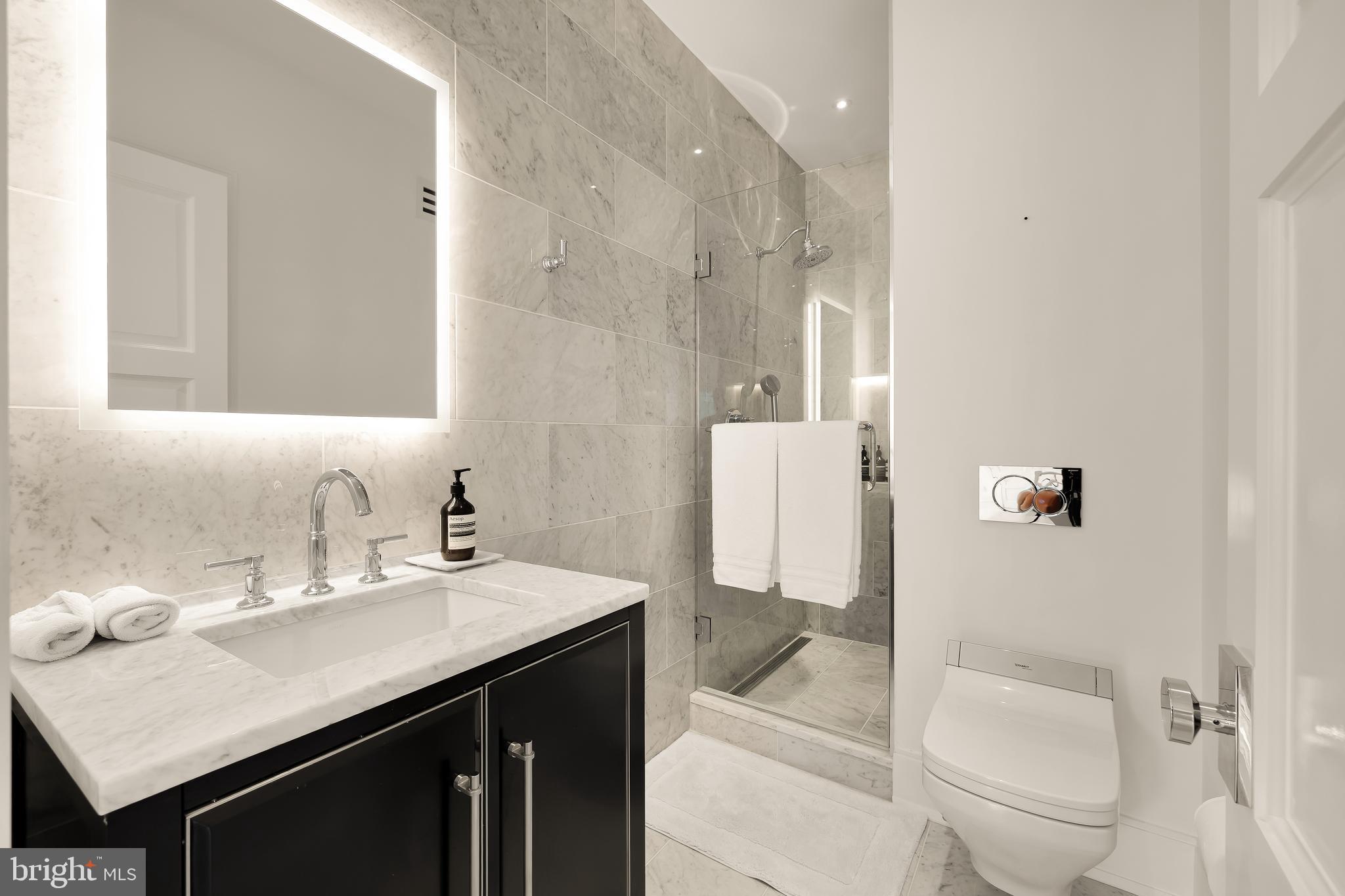 3302 Cleveland Avenue Northwest Washington, DC 20008 - Photo 35 of 54 Marble guest bathroom with smart toilet