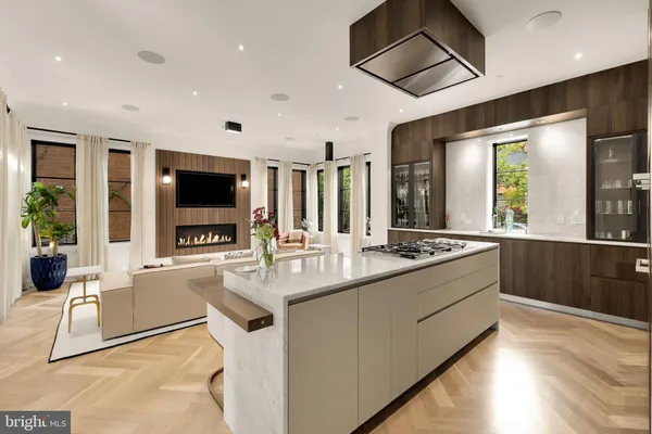 a kitchen with a sink and large window