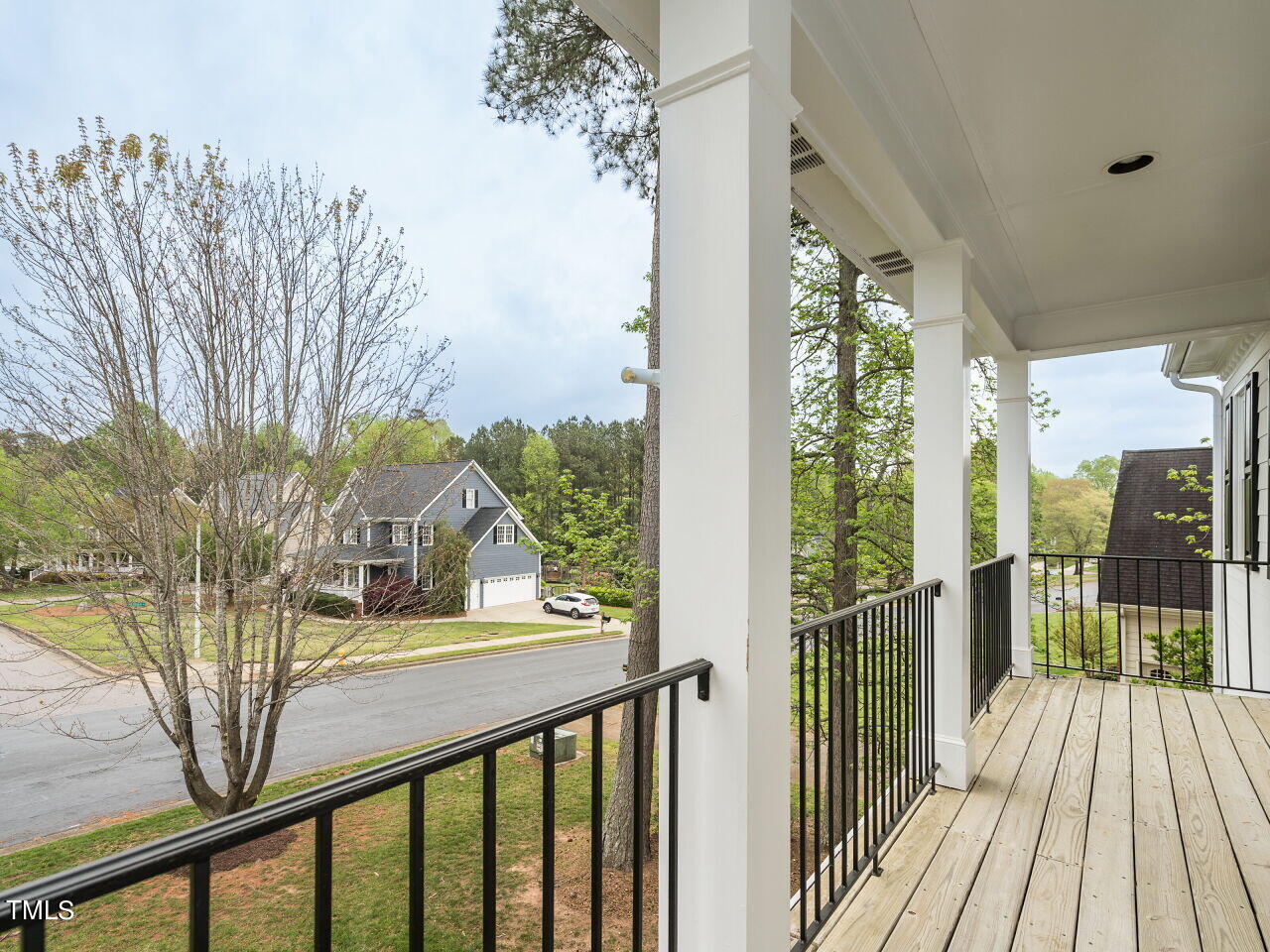 760 Hadrian Drive Garner, NC 27529 - Photo 19 of 38 a view of a balcony with wooden floor