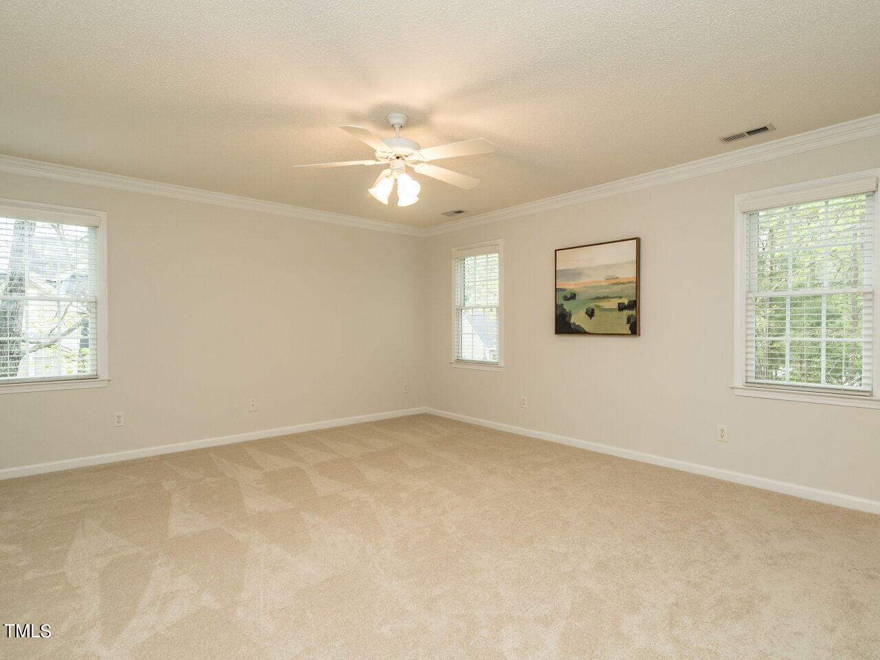 760 Hadrian Drive Garner, NC 27529 - Photo 20 of 38 an empty room with windows and fan