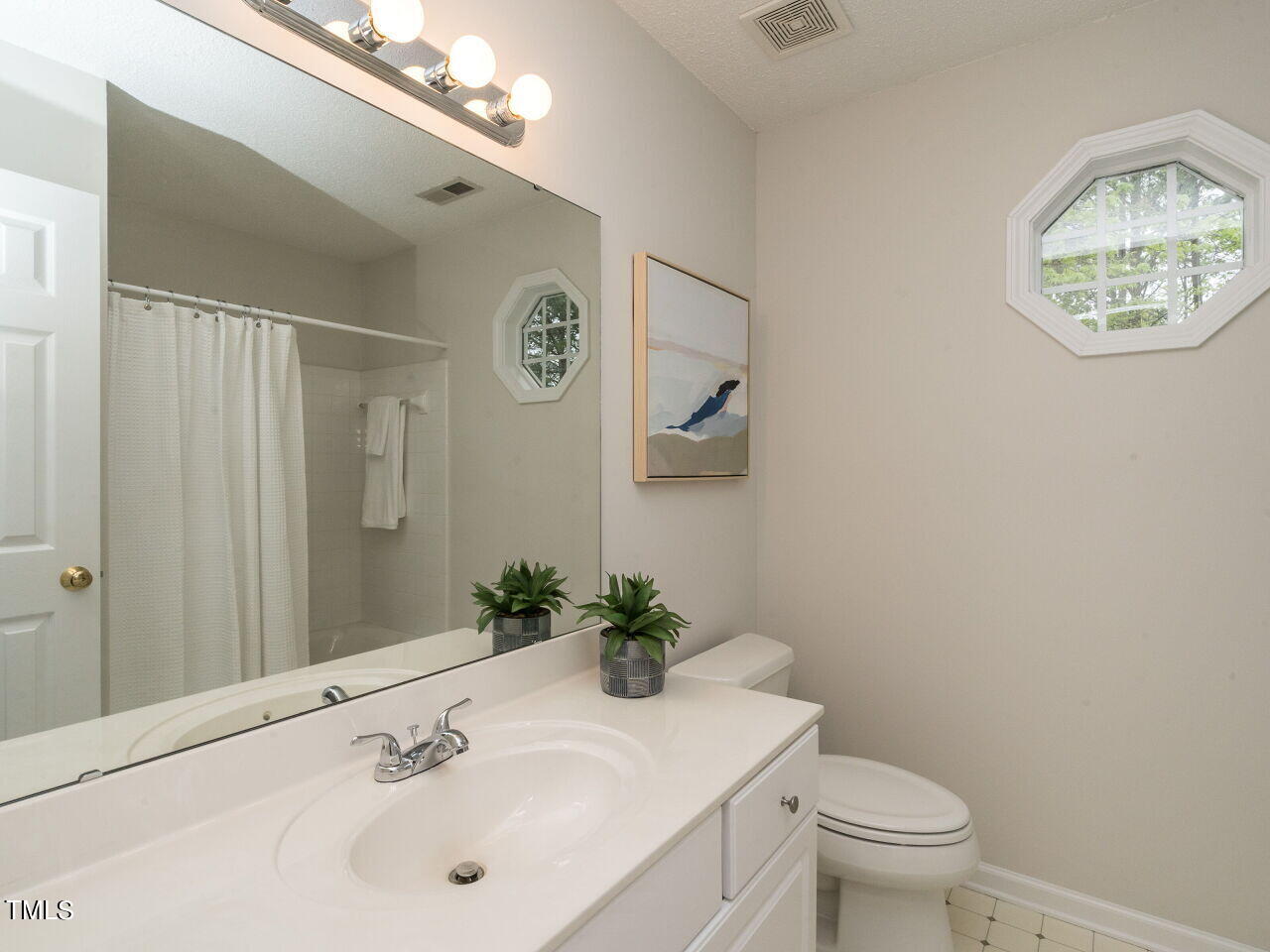 760 Hadrian Drive Garner, NC 27529 - Photo 26 of 38 a bathroom with a sink vanity and toilet