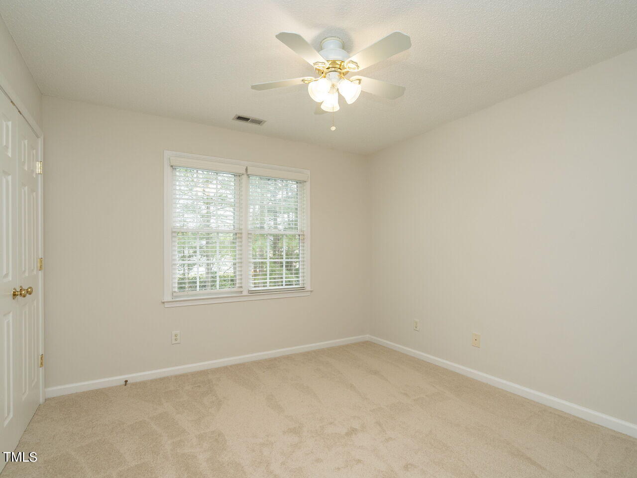760 Hadrian Drive Garner, NC 27529 - Photo 27 of 38 an empty room with a window