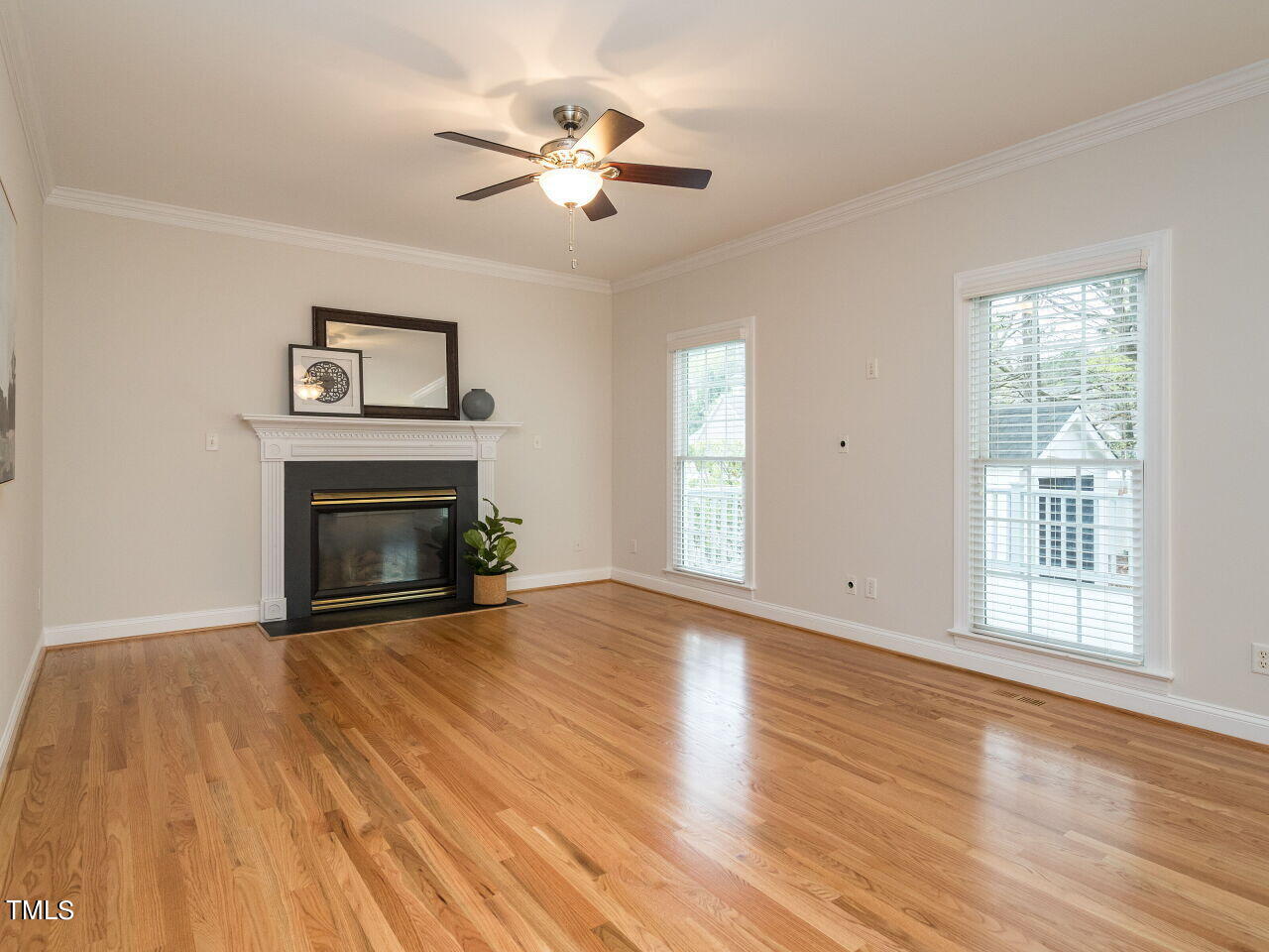 760 Hadrian Drive Garner, NC 27529 - Photo 9 of 38 a view of empty room with wooden floor and fan