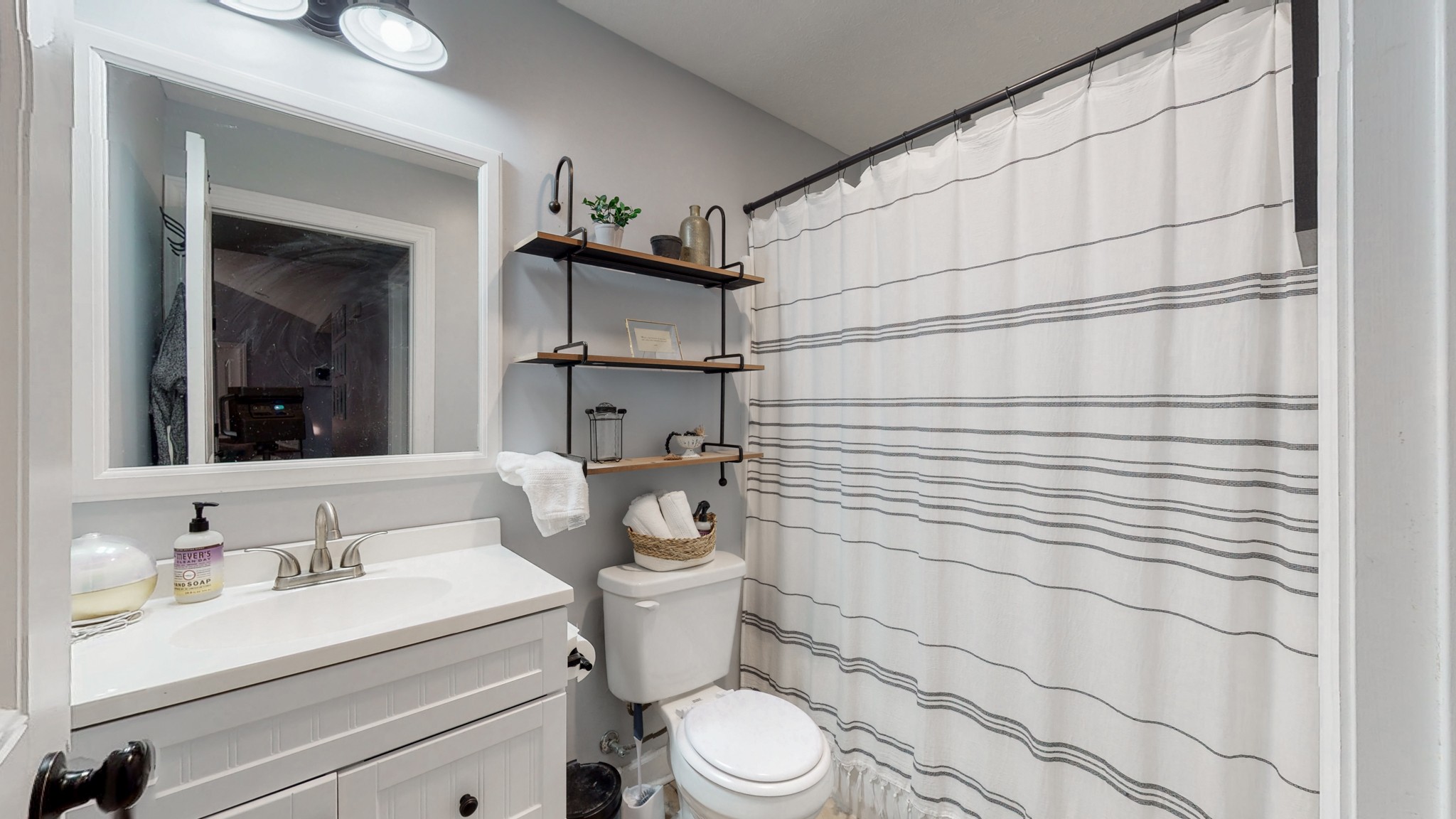 68 Hoodoo Road Manchester, TN 37355 - Photo 24 of 26 a bathroom with a granite countertop sink toilet and mirror