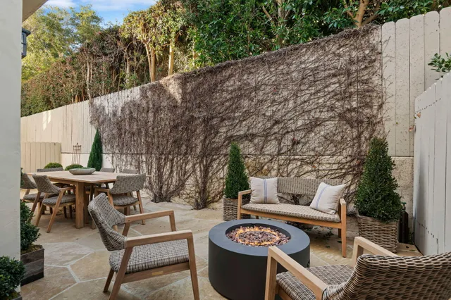 a outdoor living space with furniture and rug