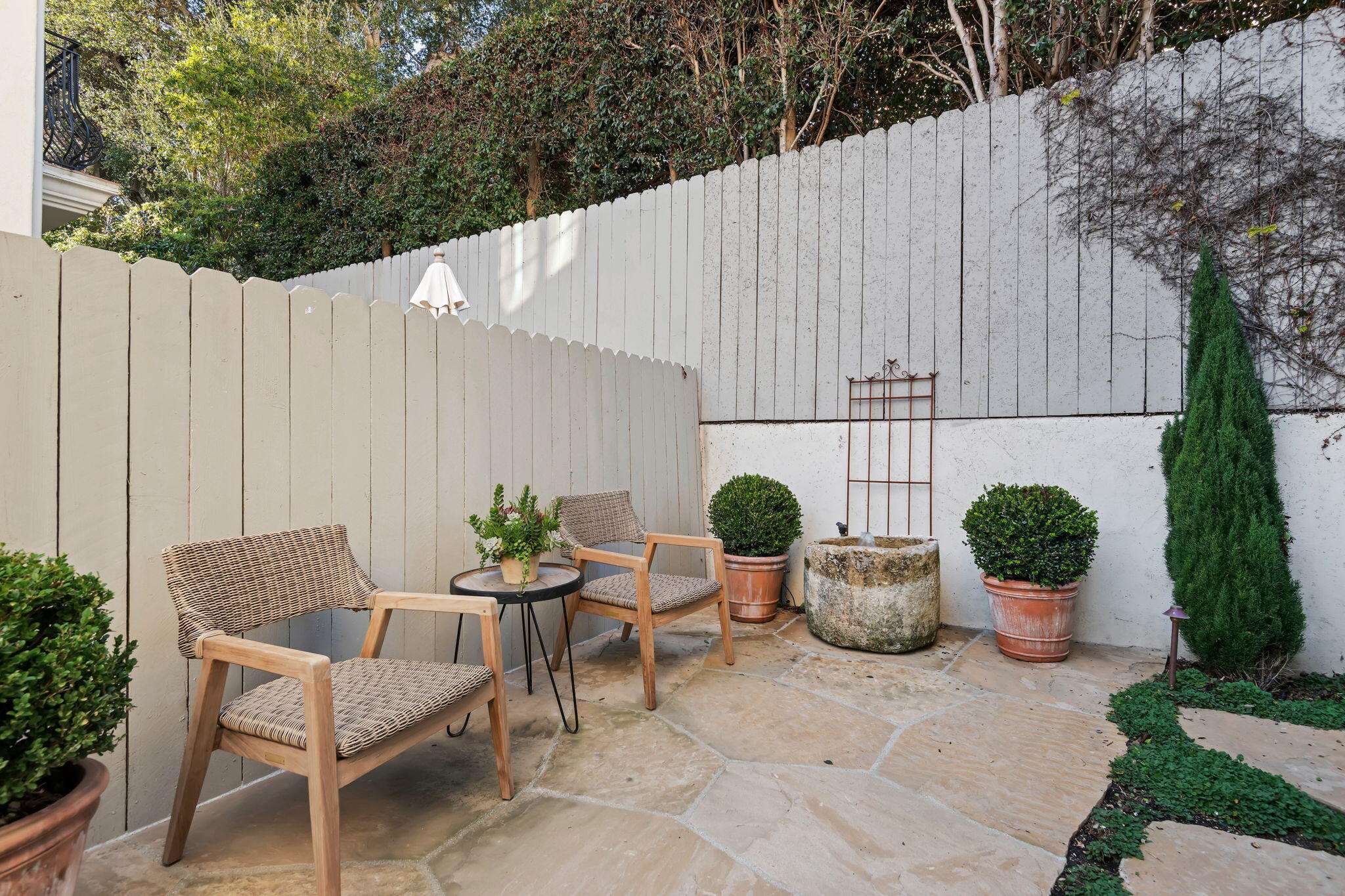 69 Olive Mill Road Montecito, CA 93108 - Photo 27 of 32 a backyard of a house with dining table and chairs