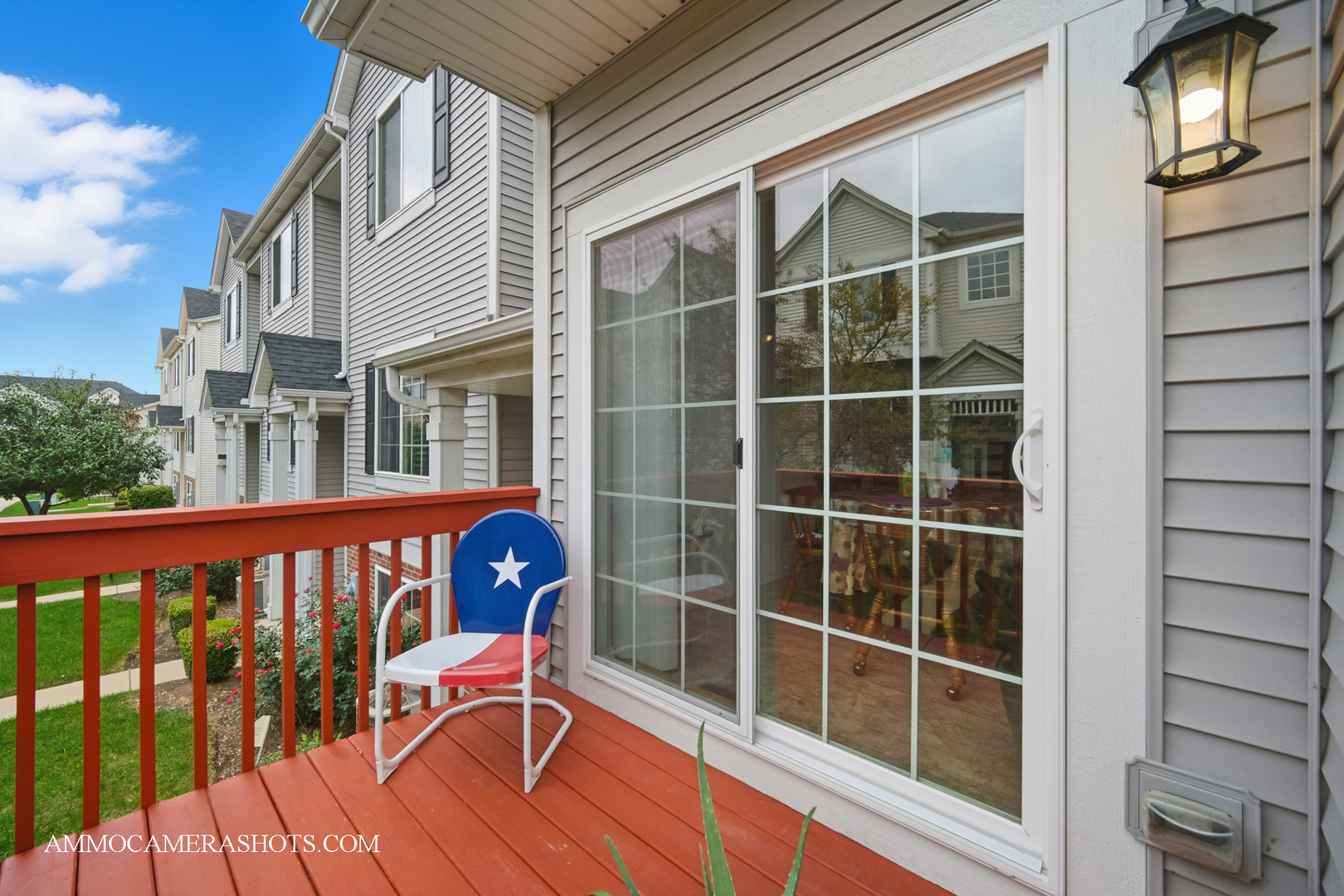 1417 Manning Avenue Montgomery, IL 60538 - Photo 13 of 26 a view of a balcony with a potted plant and wooden floor