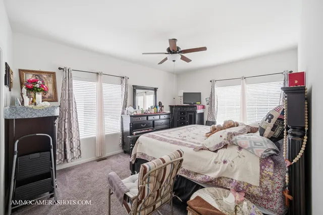 a bed room with furniture and a chandelier