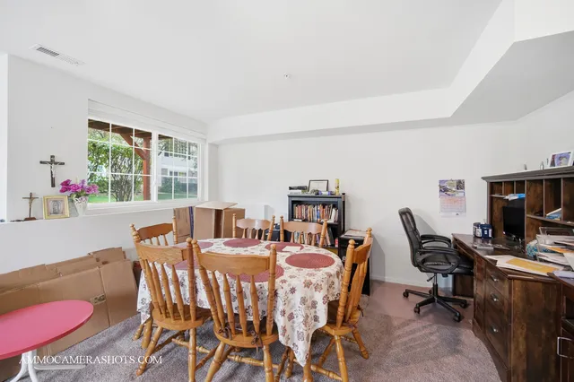 a view of a dining room with furniture window and outside view