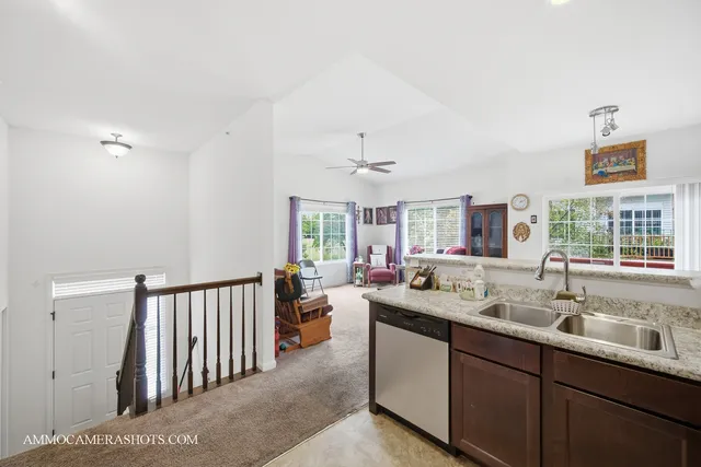 a en suite bathroom with a sink mirror and a bathtub