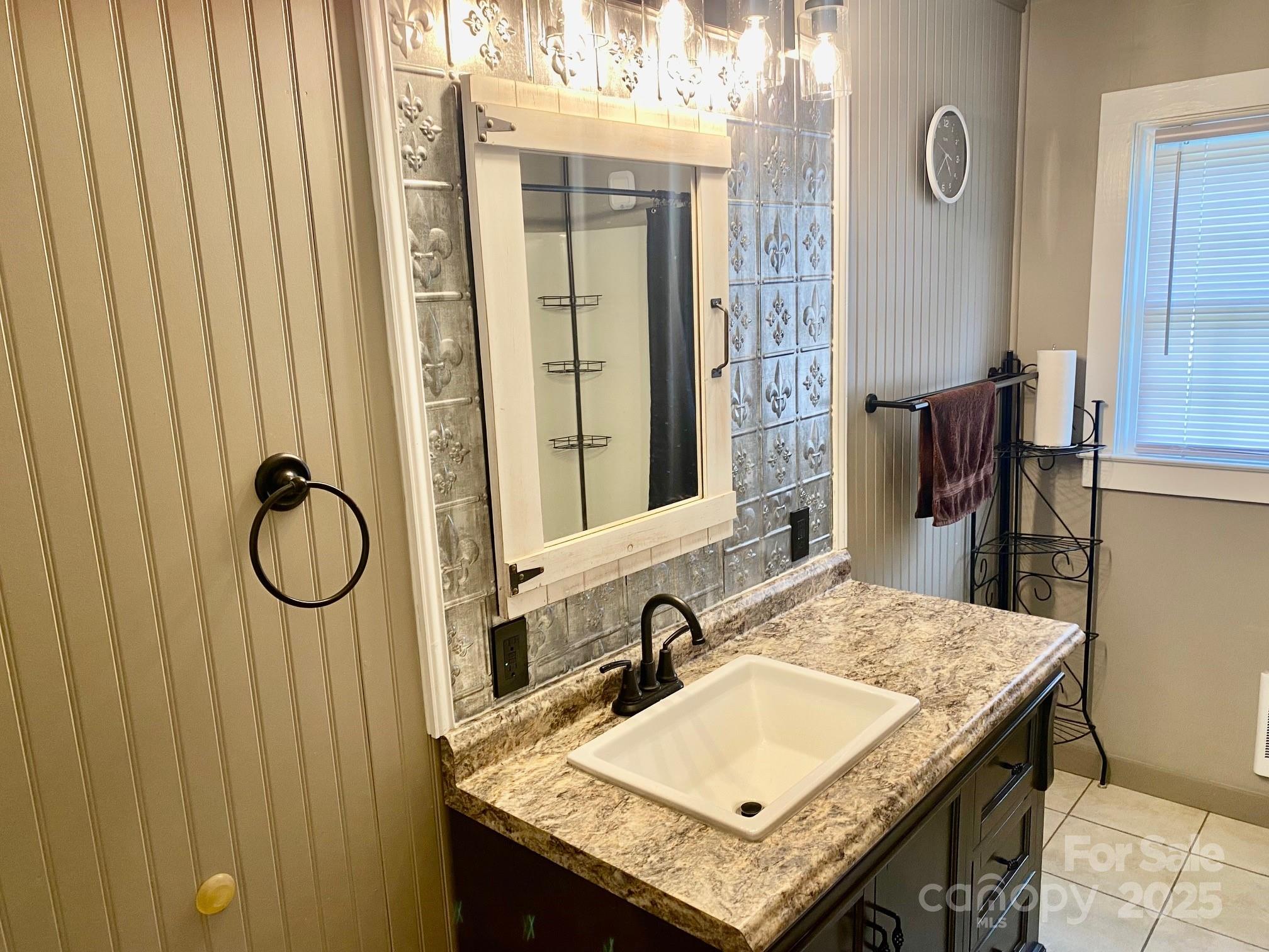1294 Cane Creek Road Bakersville, NC 28705 - Photo 22 of 43 a bathroom with a granite countertop sink and a mirror