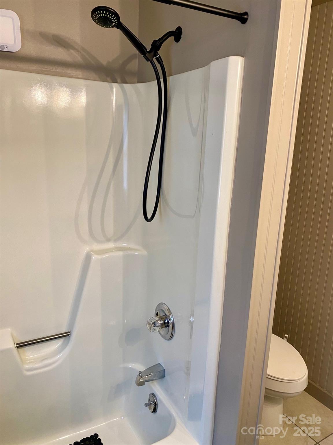 1294 Cane Creek Road Bakersville, NC 28705 - Photo 23 of 43 a bathroom with a shower and toilet