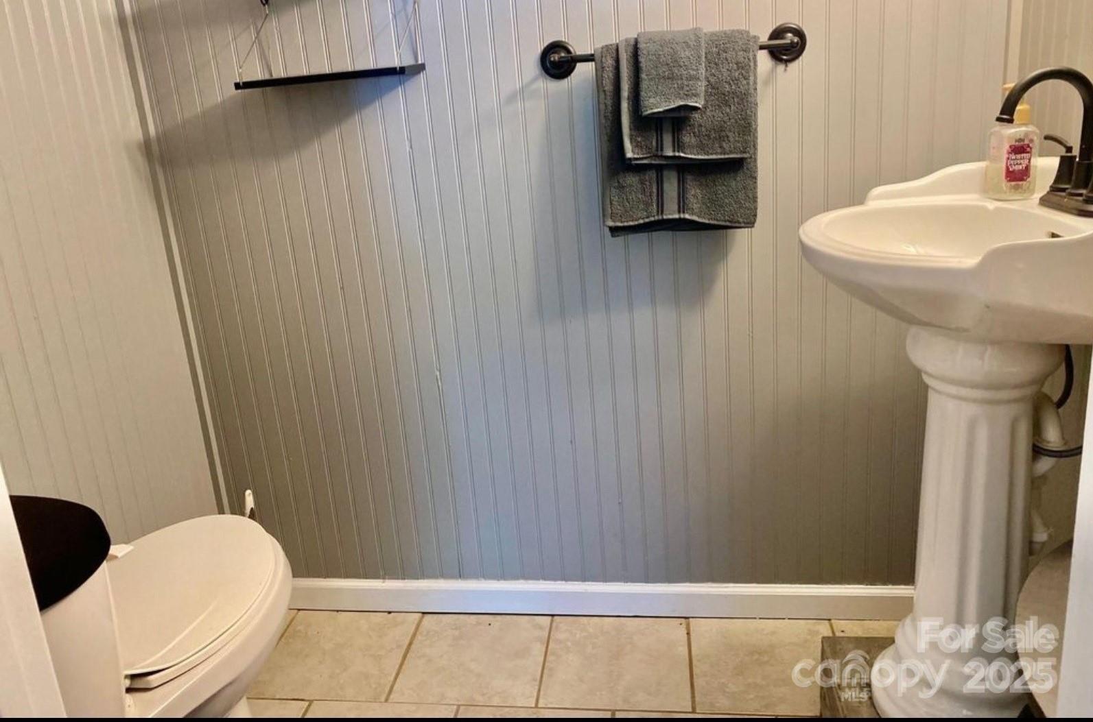 1294 Cane Creek Road Bakersville, NC 28705 - Photo 38 of 43 a bathroom with a sink toilet and shower
