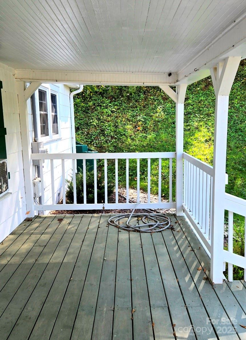 1294 Cane Creek Road Bakersville, NC 28705 - Photo 5 of 43 a view of balcony with wooden floor