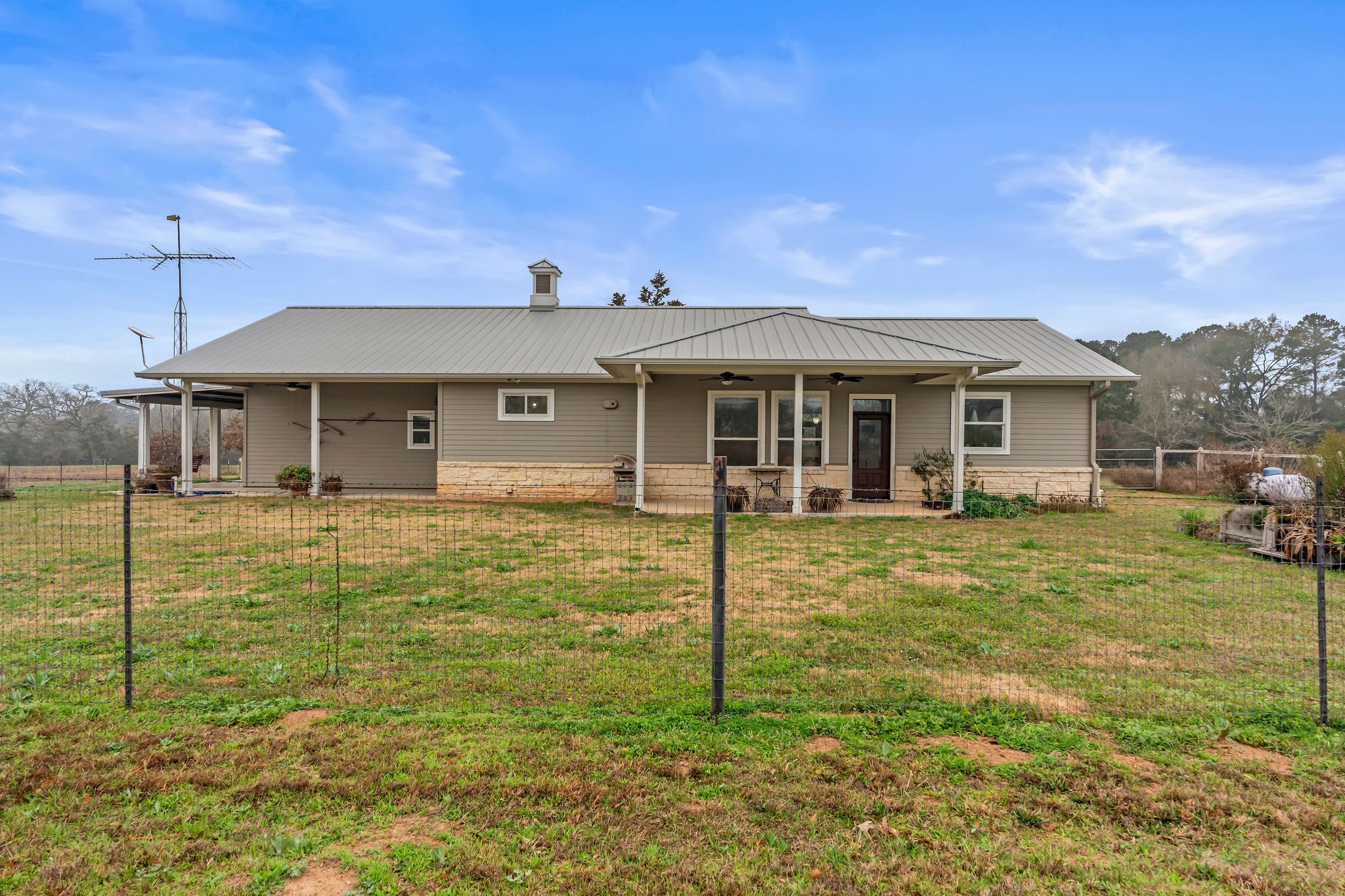 28322 Mellman Road Hempstead, TX 77445 - Photo 32 of 50 A backyard view showing another porch.
