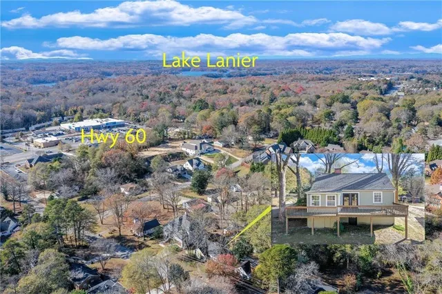 a living room with furniture a fireplace and a large window