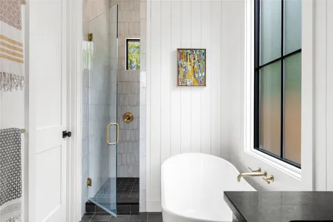 a bathroom with a tub and a sink
