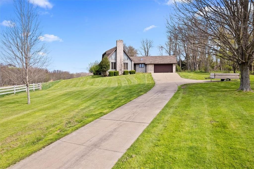 450 Vaneal Road Washington, PA 15301 - Photo 1 of 25 a front view of a house with a yard