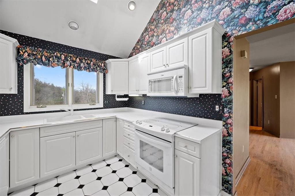 450 Vaneal Road Washington, PA 15301 - Photo 11 of 25 a kitchen with a white cabinets and white appliances