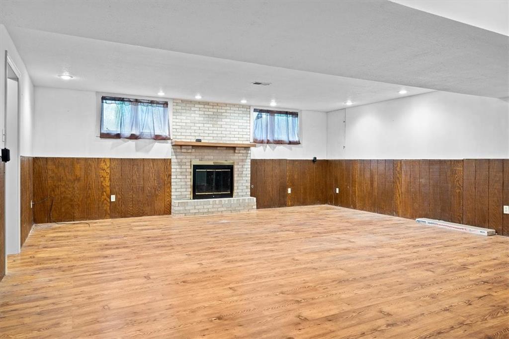 450 Vaneal Road Washington, PA 15301 - Photo 15 of 25 a view of an empty room with a fireplace and a window