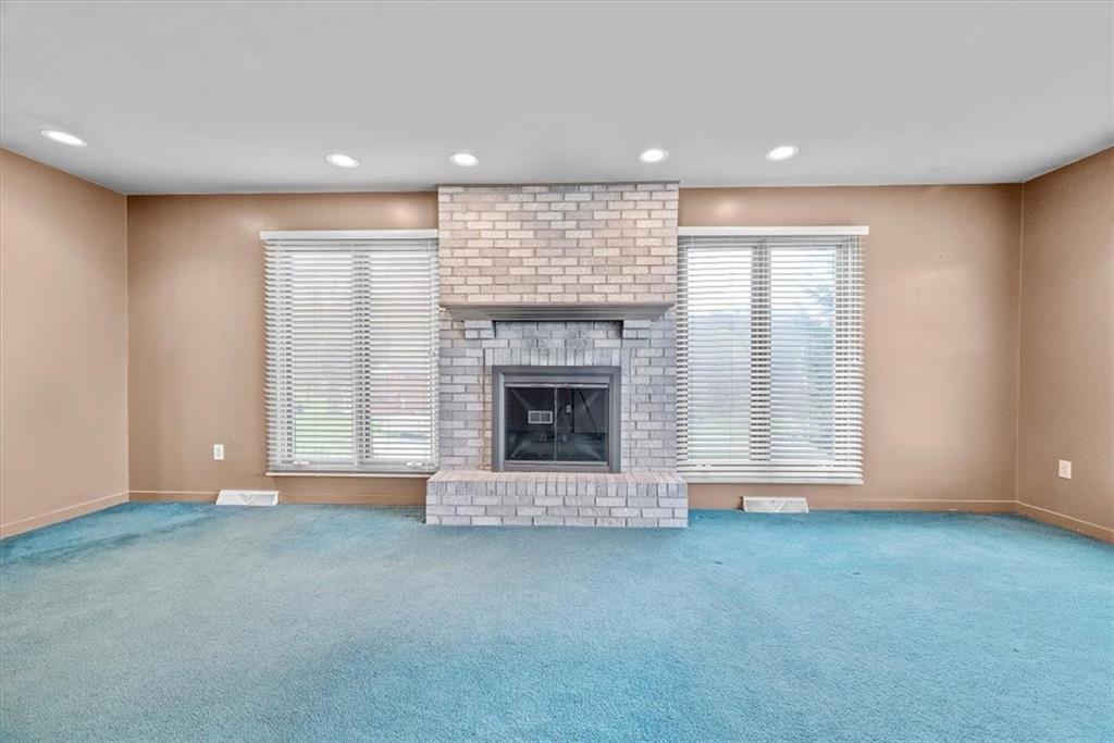 450 Vaneal Road Washington, PA 15301 - Photo 4 of 25 a view of an empty room with a fireplace and window