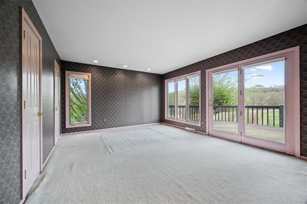 450 Vaneal Road Washington, PA 15301 - Photo 5 of 25 a view of an empty room with large windows