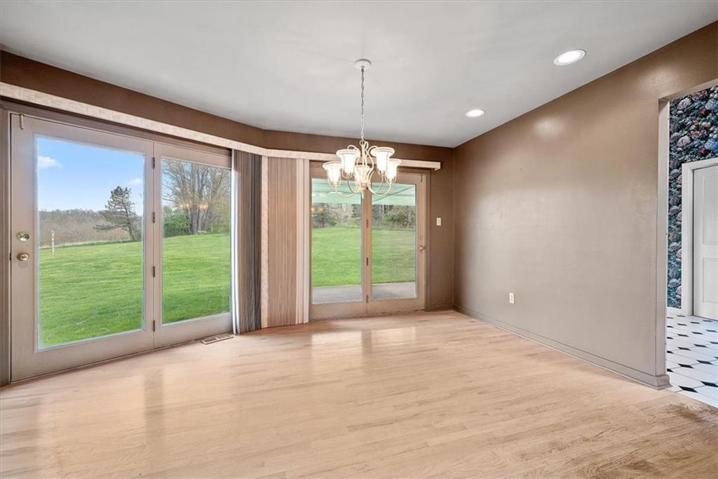 450 Vaneal Road Washington, PA 15301 - Photo 8 of 25 a view of an empty room with wooden floor and a window