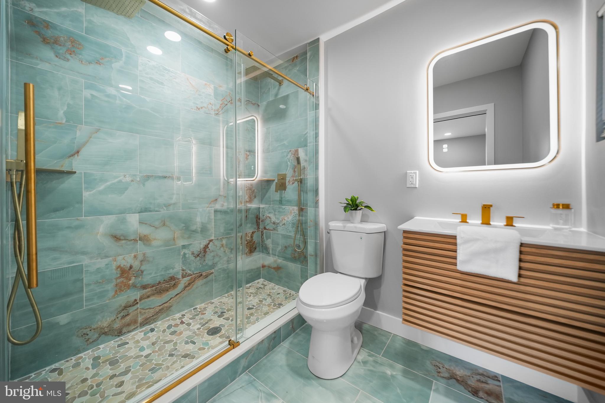 2811 Salmon Street Philadelphia, PA 19134 - Photo 13 of 25 a bathroom with a sink toilet and shower