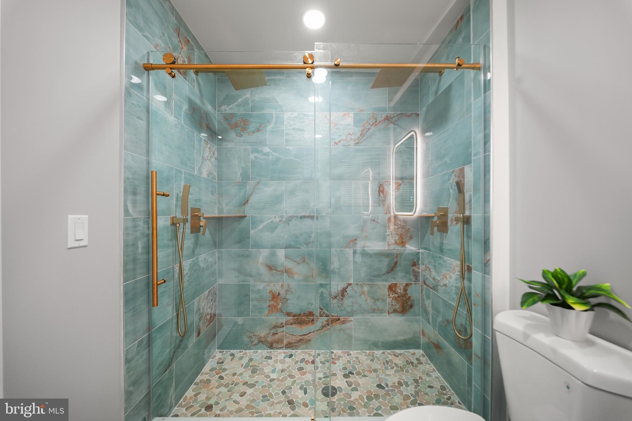 2811 Salmon Street Philadelphia, PA 19134 - Photo 14 of 25 a bathroom with a shower and a sink