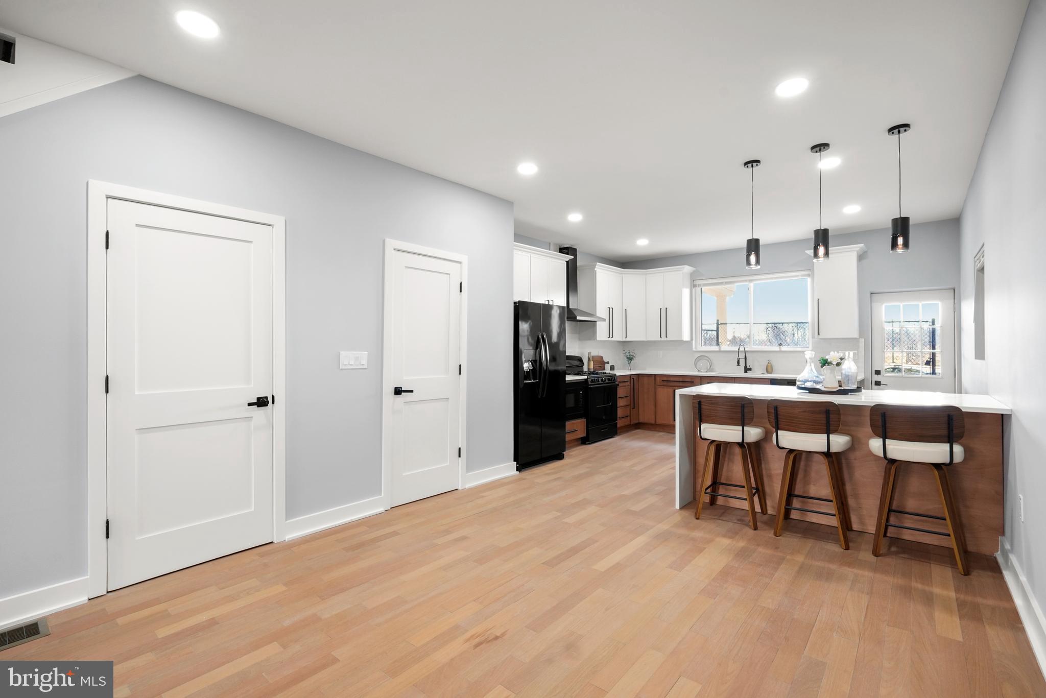 2811 Salmon Street Philadelphia, PA 19134 - Photo 3 of 25 a view of kitchen with kitchen island a sink stainless steel appliances and cabinets