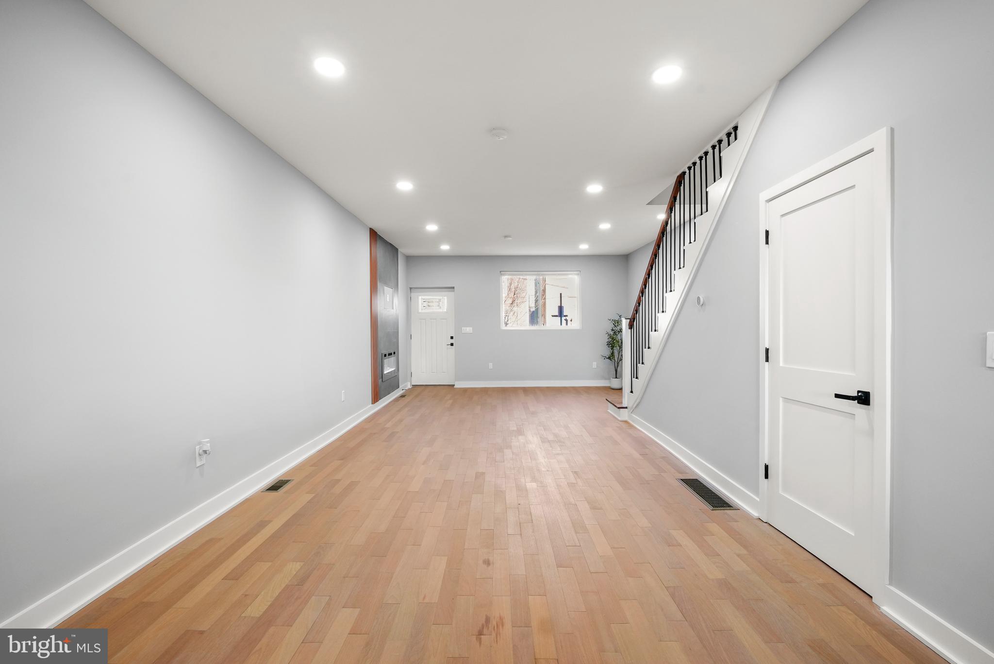 2811 Salmon Street Philadelphia, PA 19134 - Photo 6 of 25 an empty room with wooden floor and windows