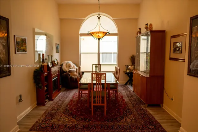 a bedroom with a bed and glass windows