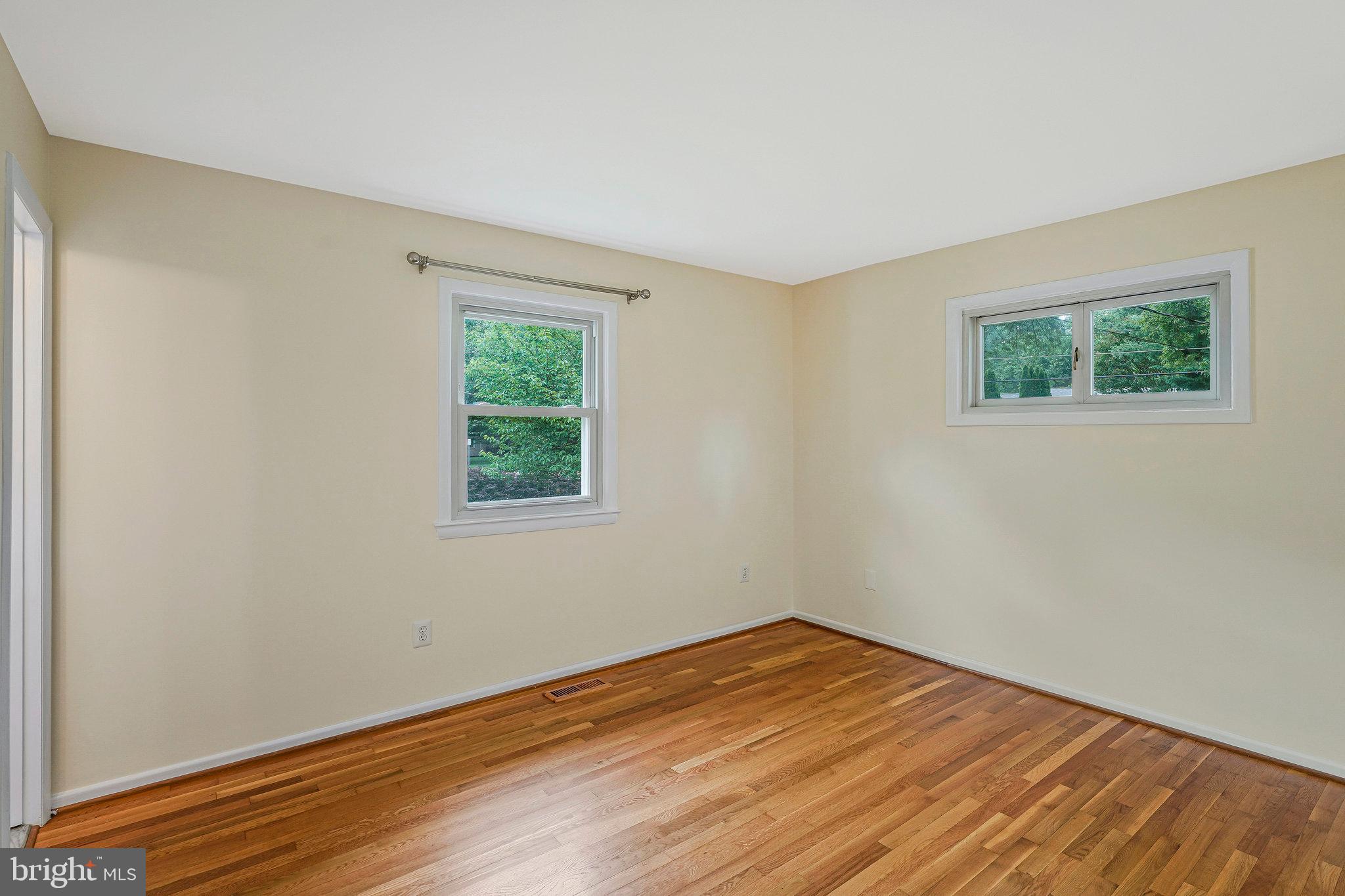8230 Citadel Place Vienna, VA 22180 - Photo 15 of 38 a view of empty room with wooden floor and fan