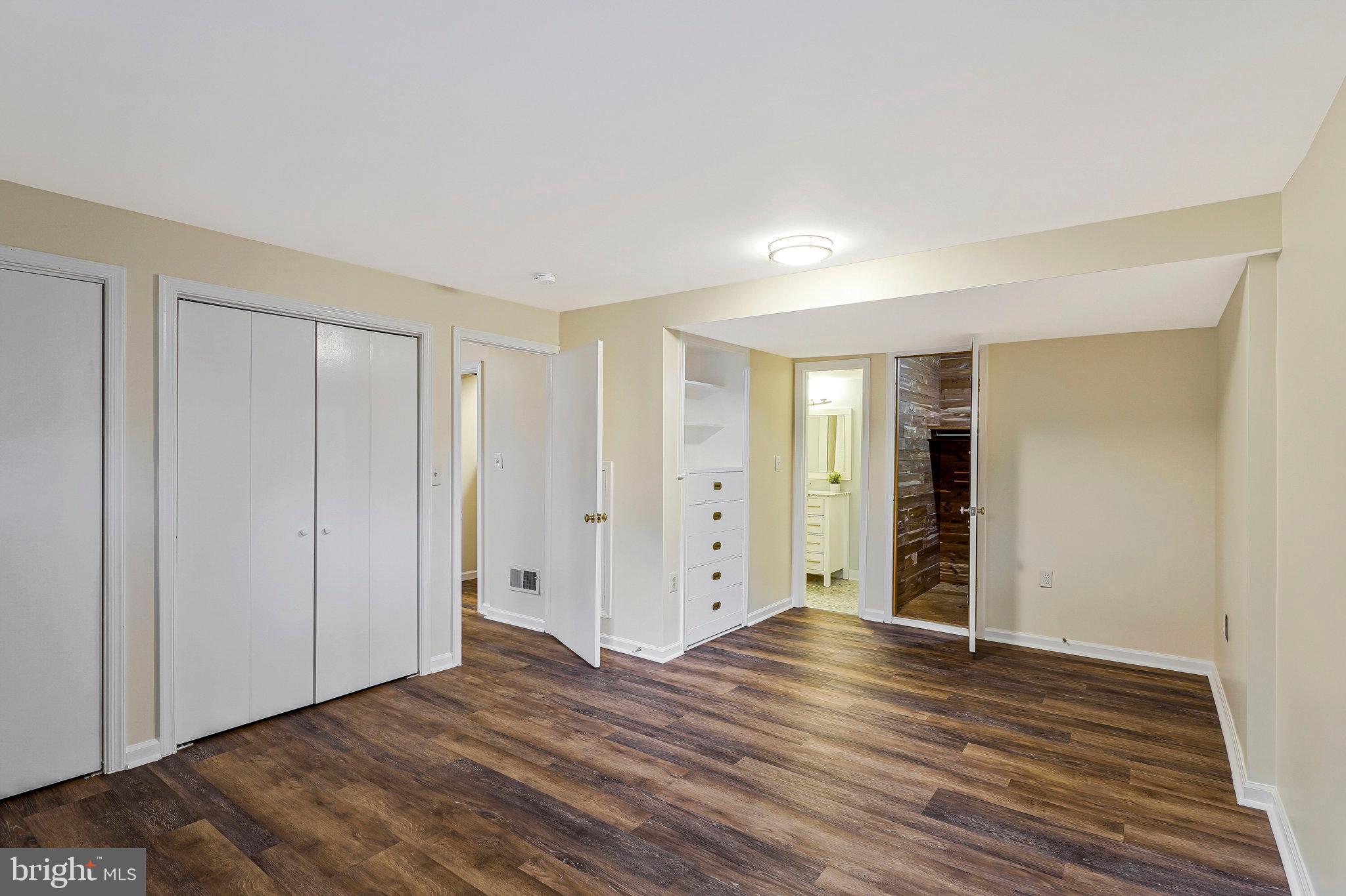 8230 Citadel Place Vienna, VA 22180 - Photo 24 of 38 a view of an empty room with wooden floor