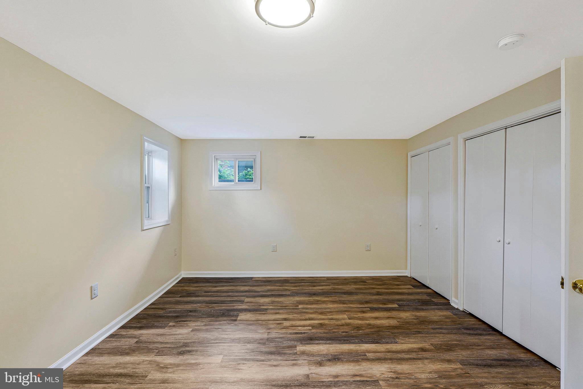 8230 Citadel Place Vienna, VA 22180 - Photo 25 of 38 a view of an empty room with wooden floor and closet