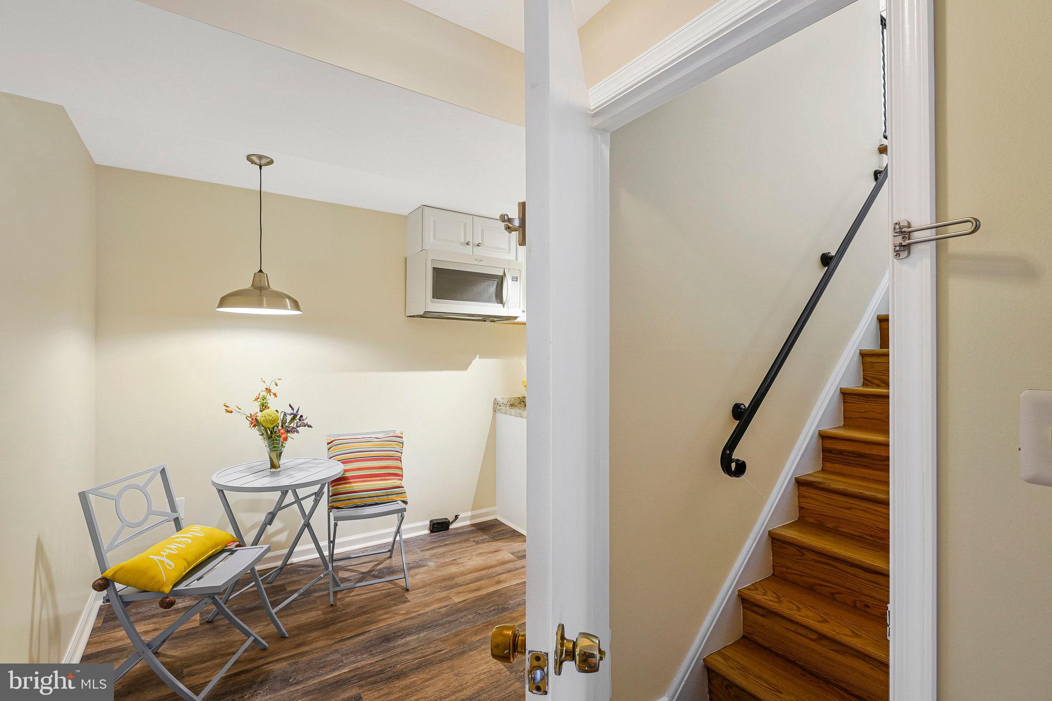 8230 Citadel Place Vienna, VA 22180 - Photo 31 of 38 a dining room with furniture and a chandelier