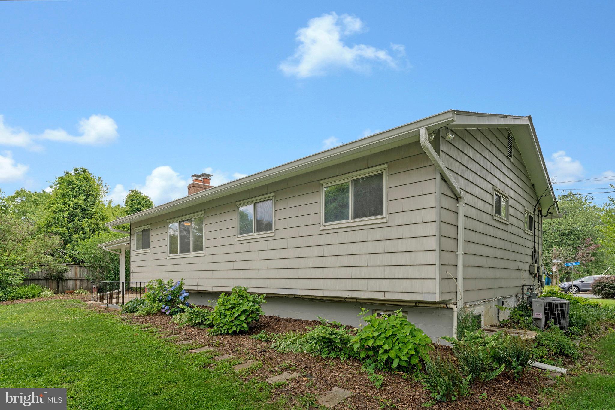 8230 Citadel Place Vienna, VA 22180 - Photo 32 of 38 a front view of a house with garden