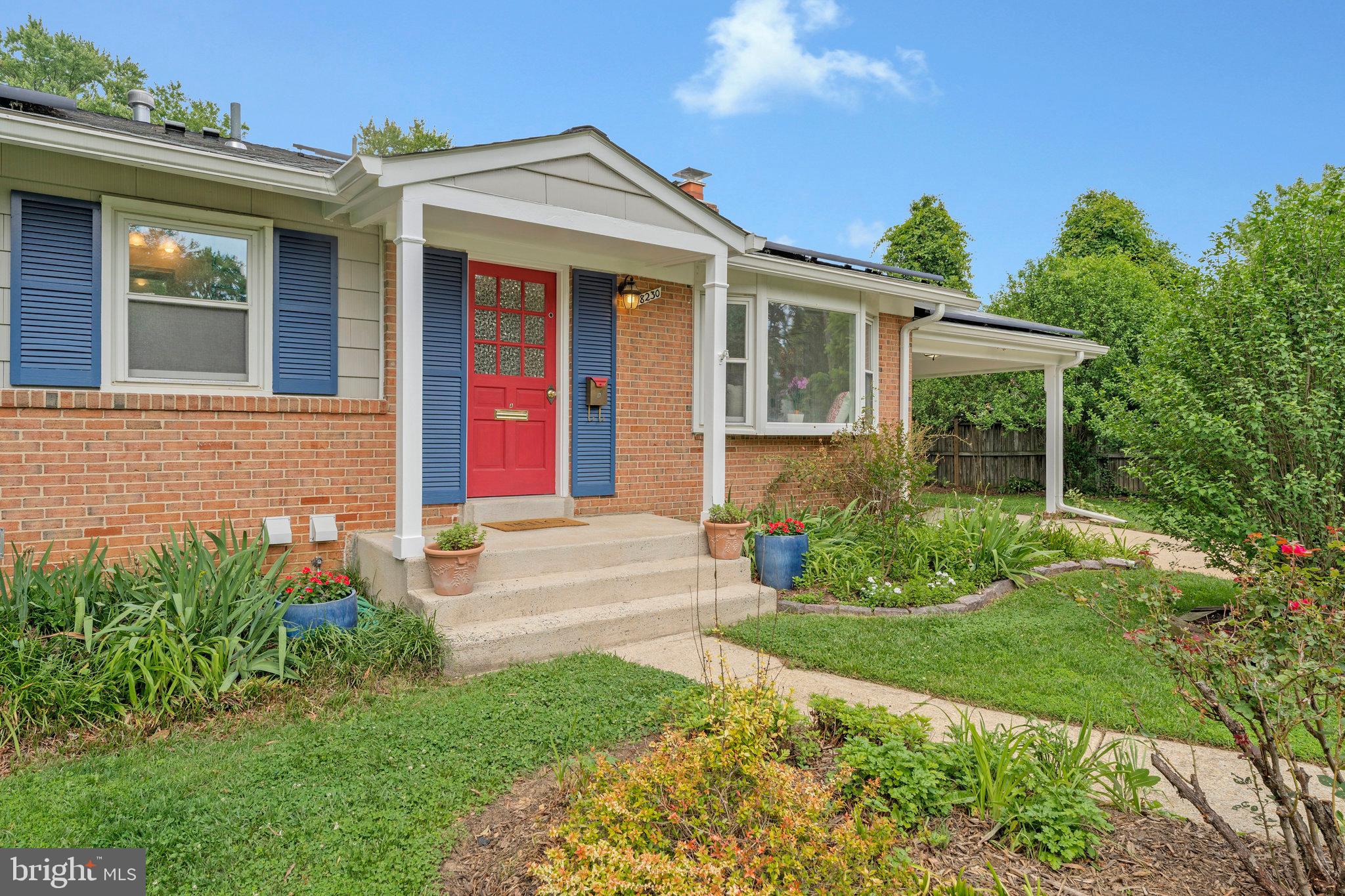 8230 Citadel Place Vienna, VA 22180 - Photo 4 of 38 front view of a house with a yard
