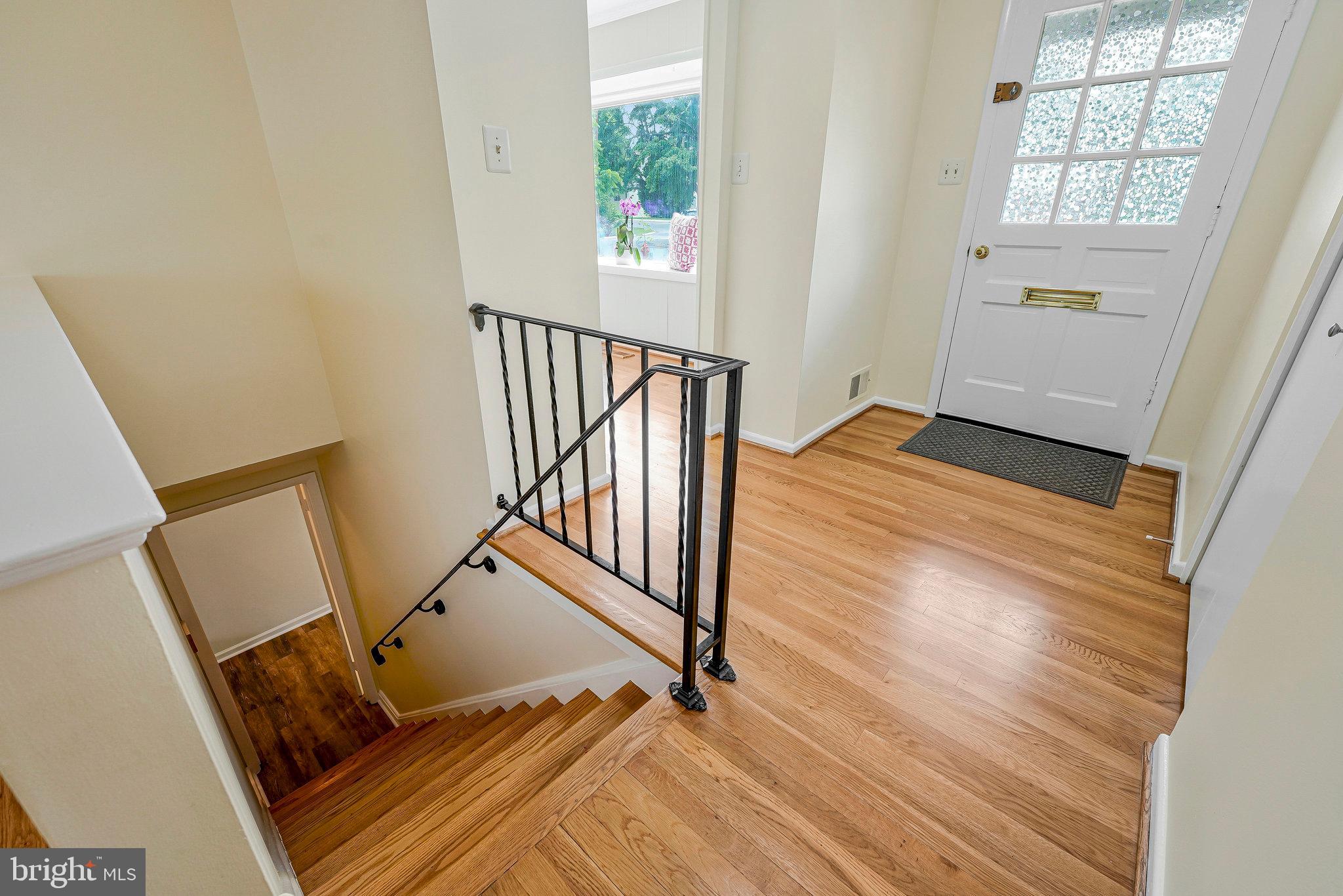 8230 Citadel Place Vienna, VA 22180 - Photo 5 of 38 a view of entryway with wooden floor and stairs