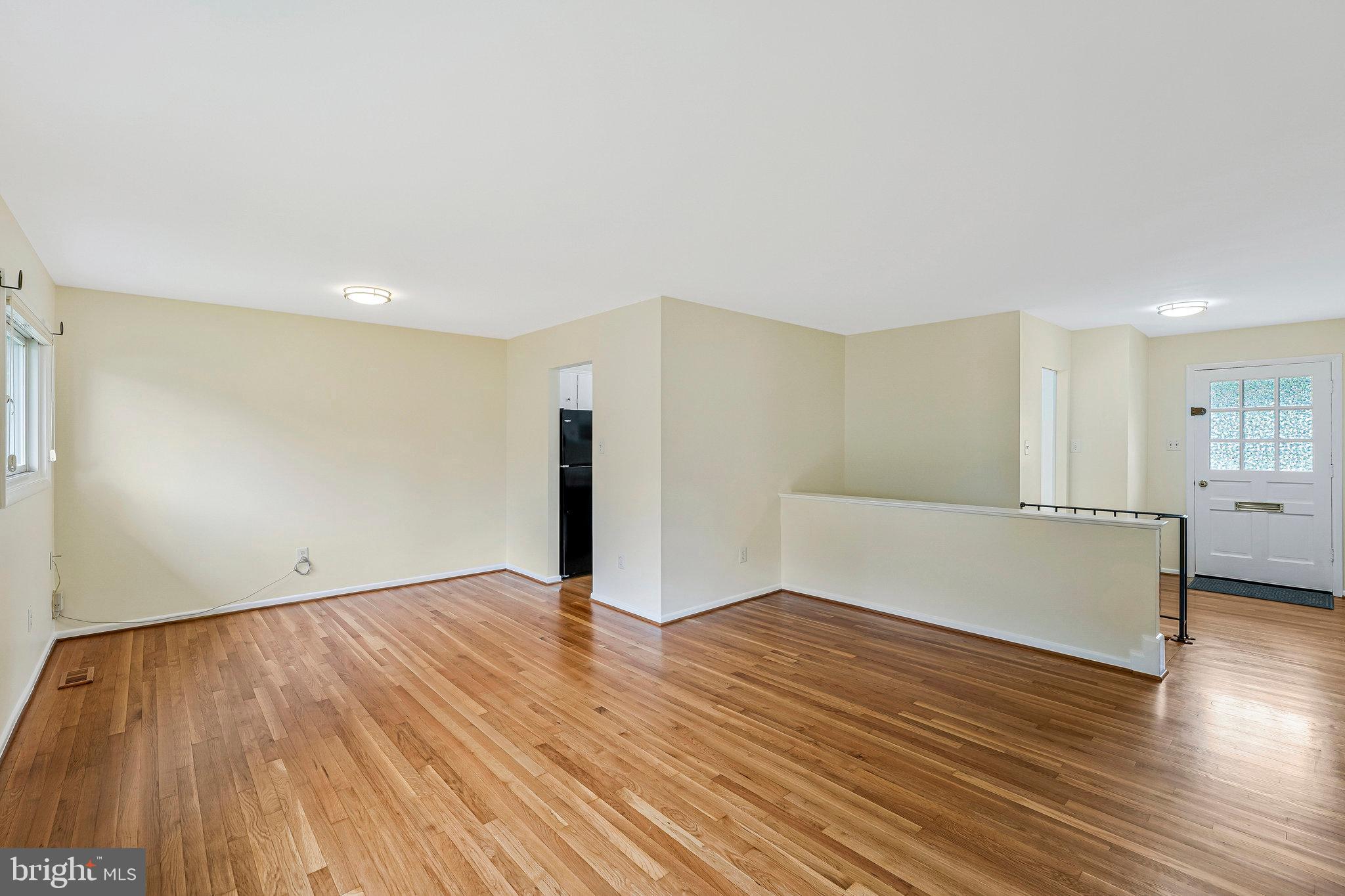 8230 Citadel Place Vienna, VA 22180 - Photo 7 of 38 a view of an empty room with wooden floor