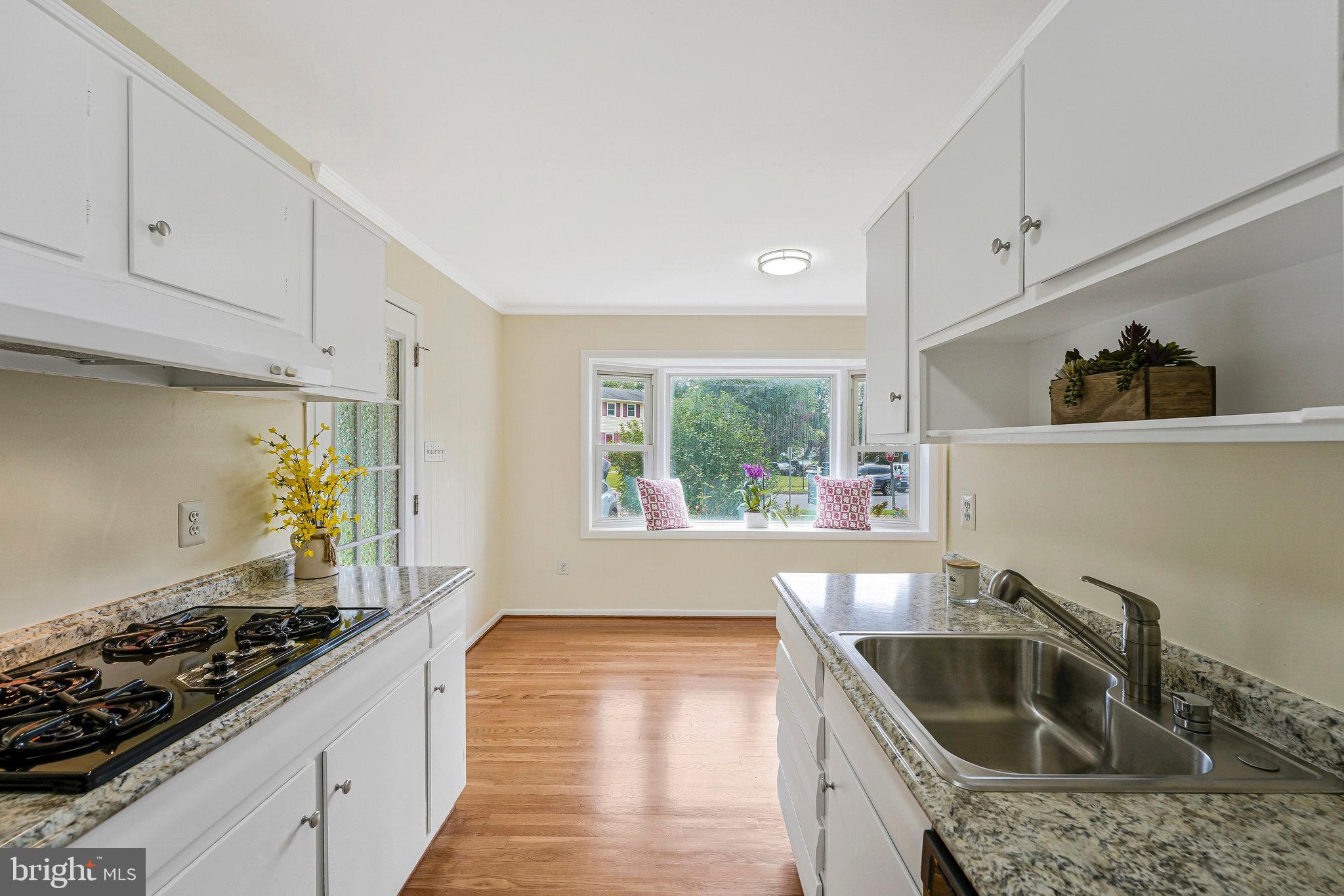 8230 Citadel Place Vienna, VA 22180 - Photo 9 of 38 a kitchen with a stove a sink and a refrigerator