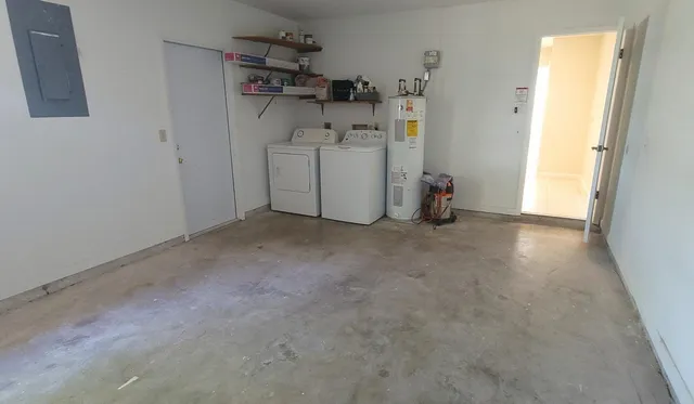 a view of a storage & utility room with a refrigerator