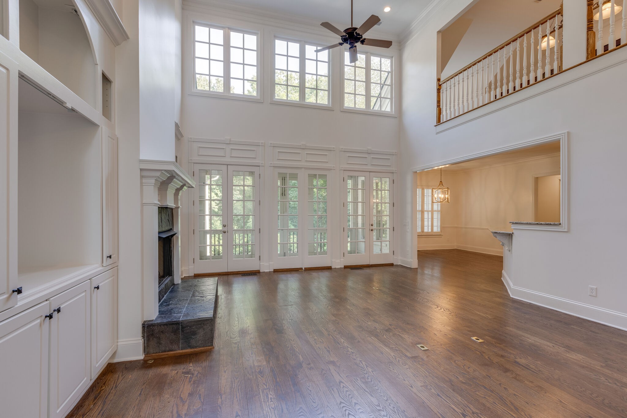 1438 Willowbrooke Circle Franklin, TN 37069 - Photo 12 of 45 a view of an empty room with wooden floor and a window