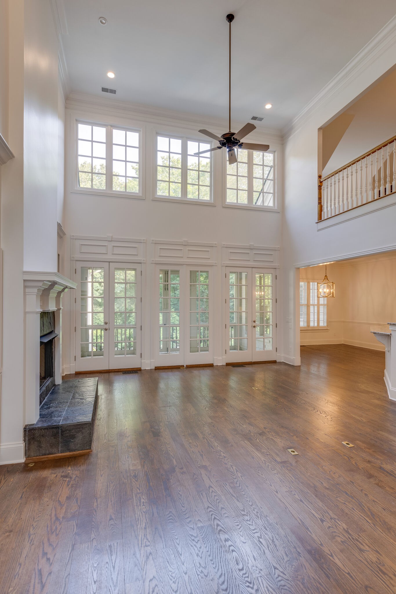 1438 Willowbrooke Circle Franklin, TN 37069 - Photo 16 of 45 a view of an empty room with wooden floor and a window