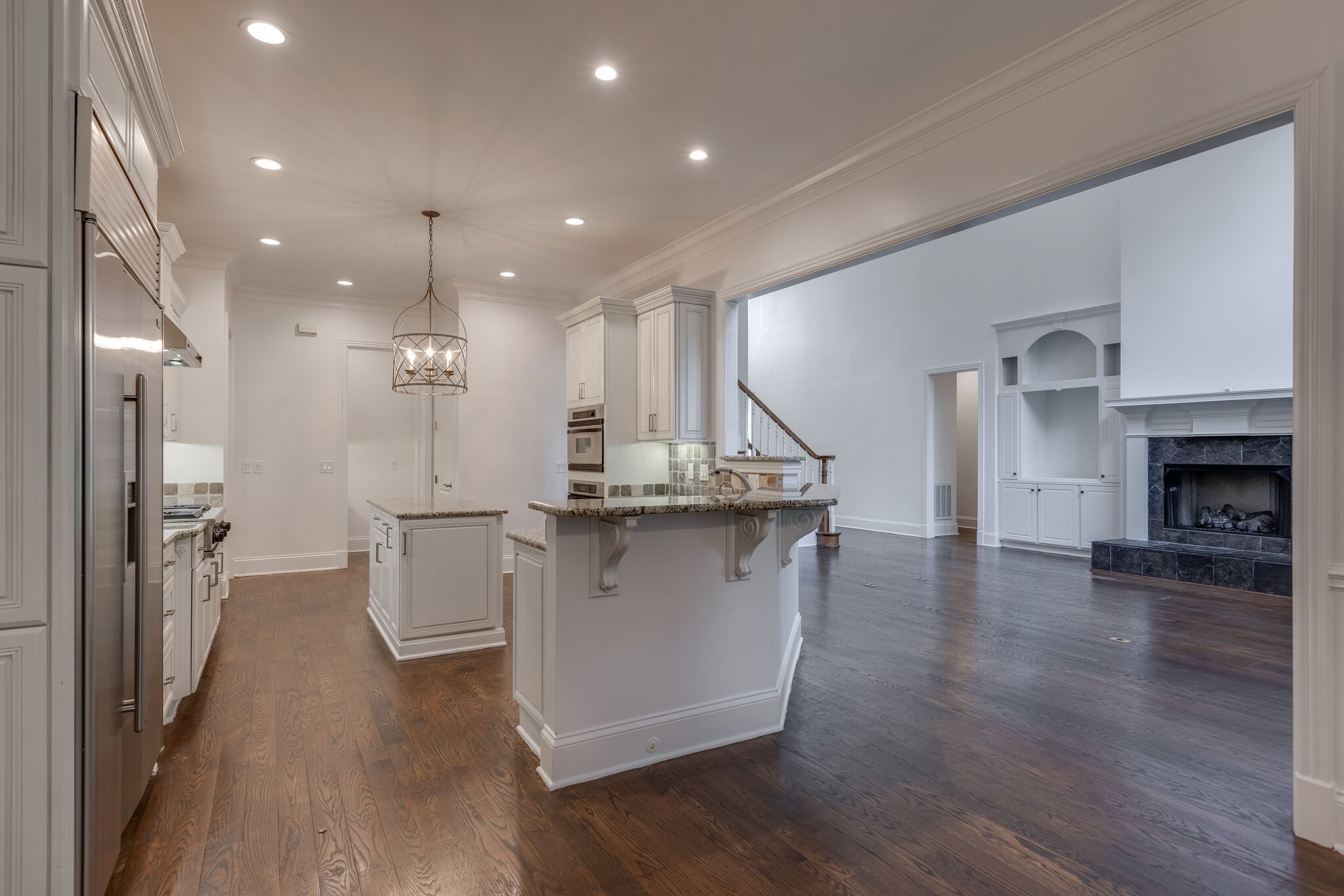 1438 Willowbrooke Circle Franklin, TN 37069 - Photo 20 of 45 a view of a living room and kitchen with a wooden floor
