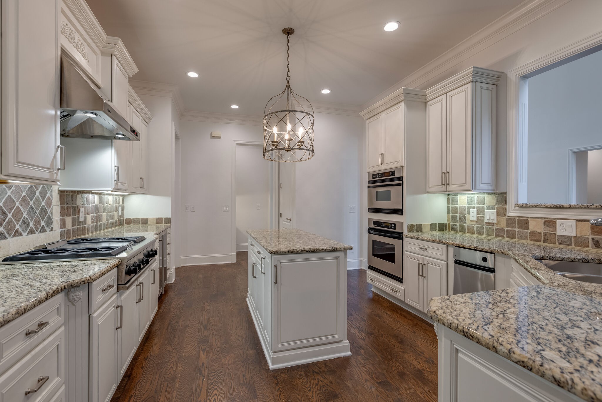 1438 Willowbrooke Circle Franklin, TN 37069 - Photo 21 of 45 a large kitchen with stainless steel appliances granite countertop a stove oven and a white cabinets
