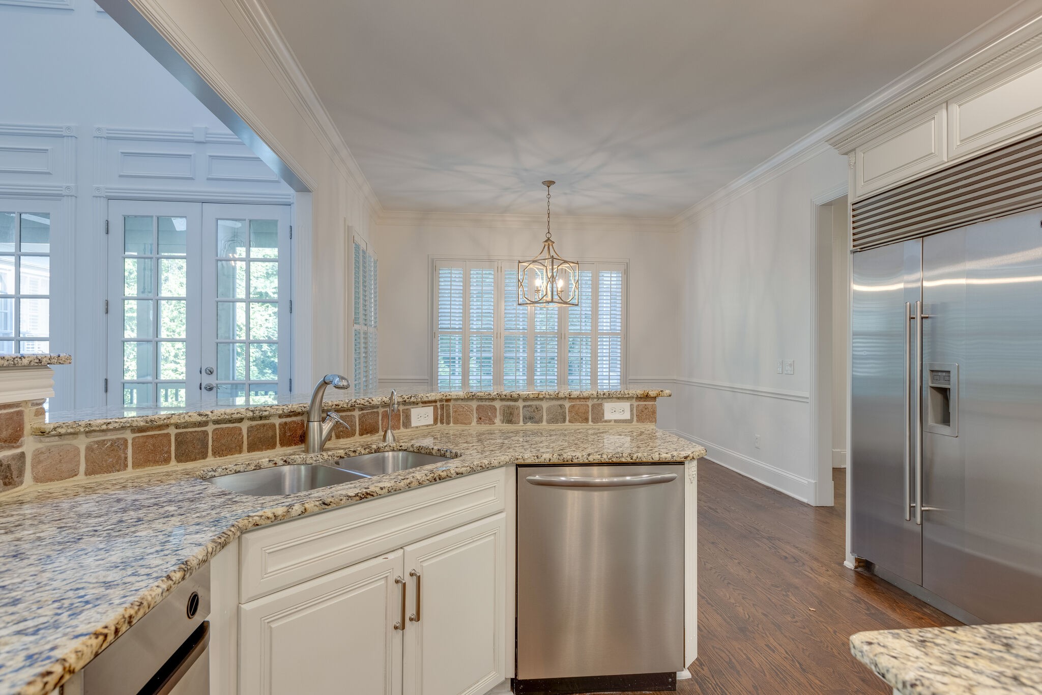 1438 Willowbrooke Circle Franklin, TN 37069 - Photo 24 of 45 a kitchen with granite countertop a sink and a wooden floor