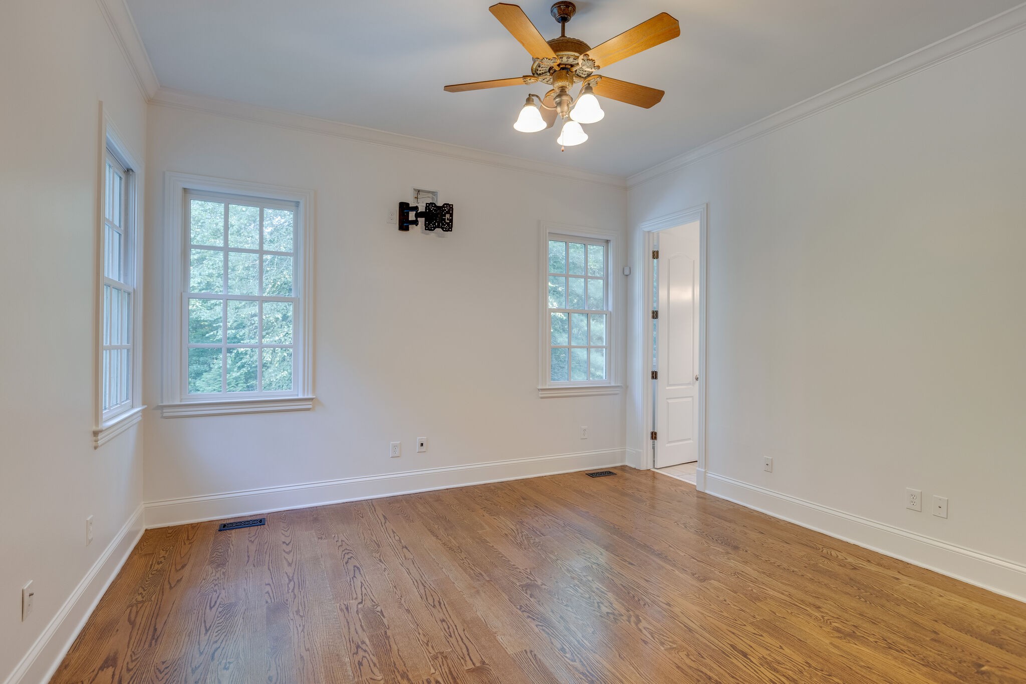 1438 Willowbrooke Circle Franklin, TN 37069 - Photo 33 of 45 an empty room with wooden floor fan and windows