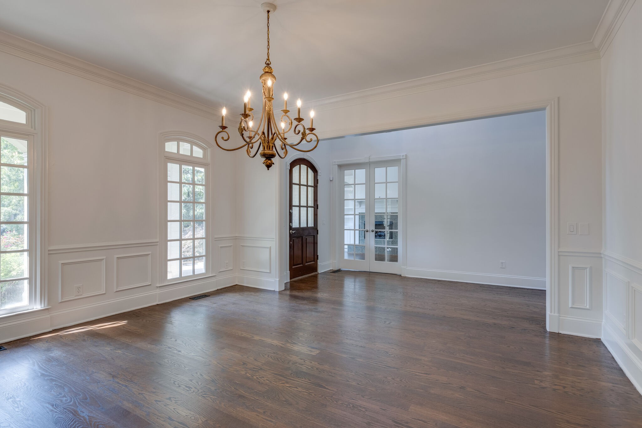 1438 Willowbrooke Circle Franklin, TN 37069 - Photo 9 of 45 a view of an empty room with wooden floor and a window